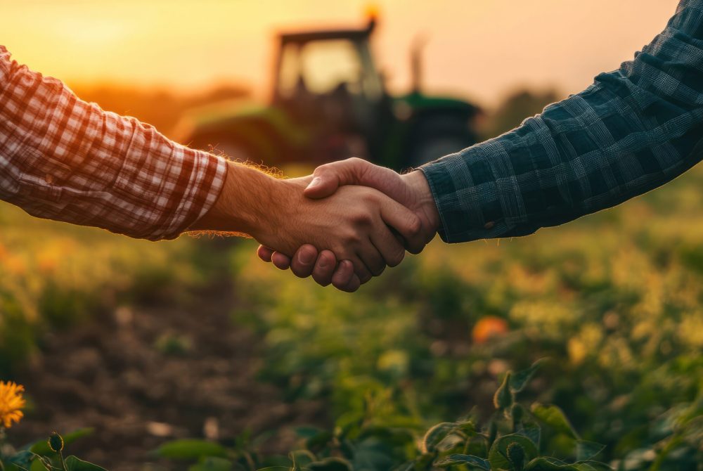 agribusiness handshake business deal agreement between businessman and farmer, purchase sell tractor farm machinery equipment, partnership cooperation collaboration in agriculture business.